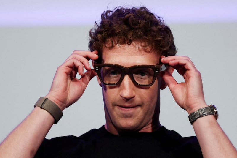 Meta CEO Mark Zuckerberg wears the Meta Ray-Ban Display glasses, as he delivers a speech presenting the new line of smart glasses, during the Meta Connect event at the company's headquarters in Menlo Park, California, U.S., September 17, 2025. REUTERS/Carlos Barria     TPX IMAGES OF THE DAY