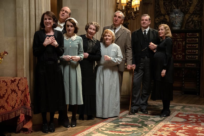 Jim Carter, Raquel Cassidy, Brendan Coyle, Kevin Doyle, Joanne Froggatt, Phyllis Logan, Lesley Nicol, and Sophie McShera in Downton Abbey: The Grand Finale.