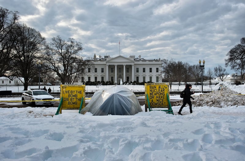 An activist sits at a protest sight in Lafayette Park across from the White House January 26, 2016 in Washington, DC. Concepcion Picciotto, the protester who began and maintained a peace vigil in Lafayette Park across from the White House for more than three decades, a demonstration widely considered to be the longest-running act of political protest in US history, died January 25, 2016 in Washington. She was born Concepción Martín in Vigo, Spain, in 1945, and emigrated to the US at the age of 18. / AFP / Brendan Smialowski (Photo credit should read BRENDAN SMIALOWSKI/AFP via Getty Images)