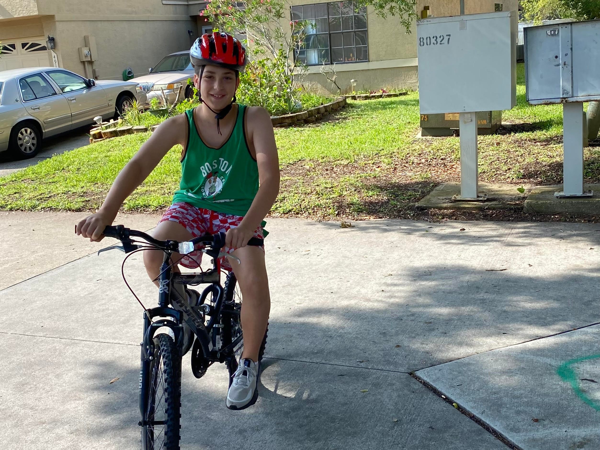 The author's son on his bike in their neighborhood in Florida.