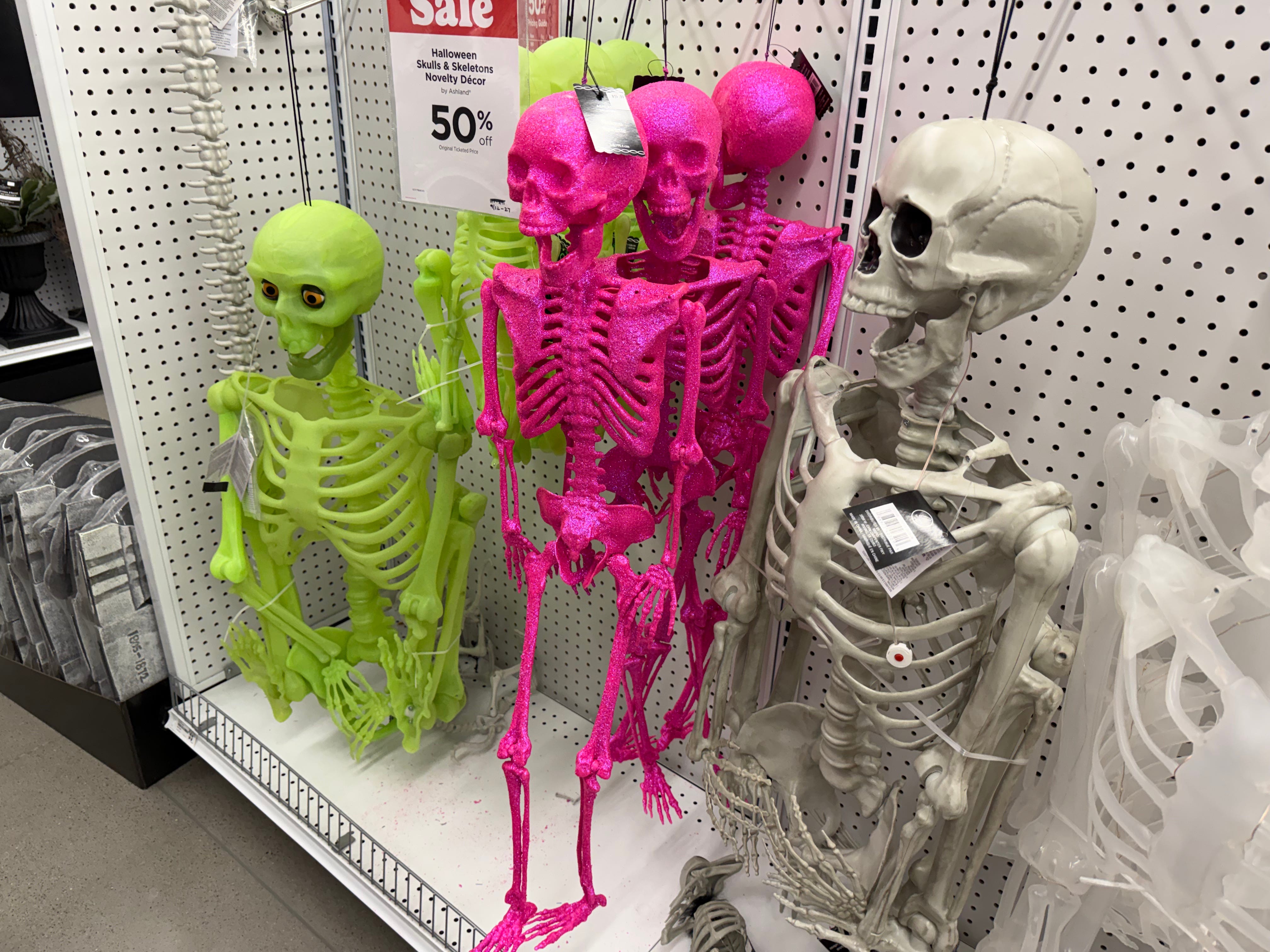 Green, pink, beige skeleton decorations in Michaels