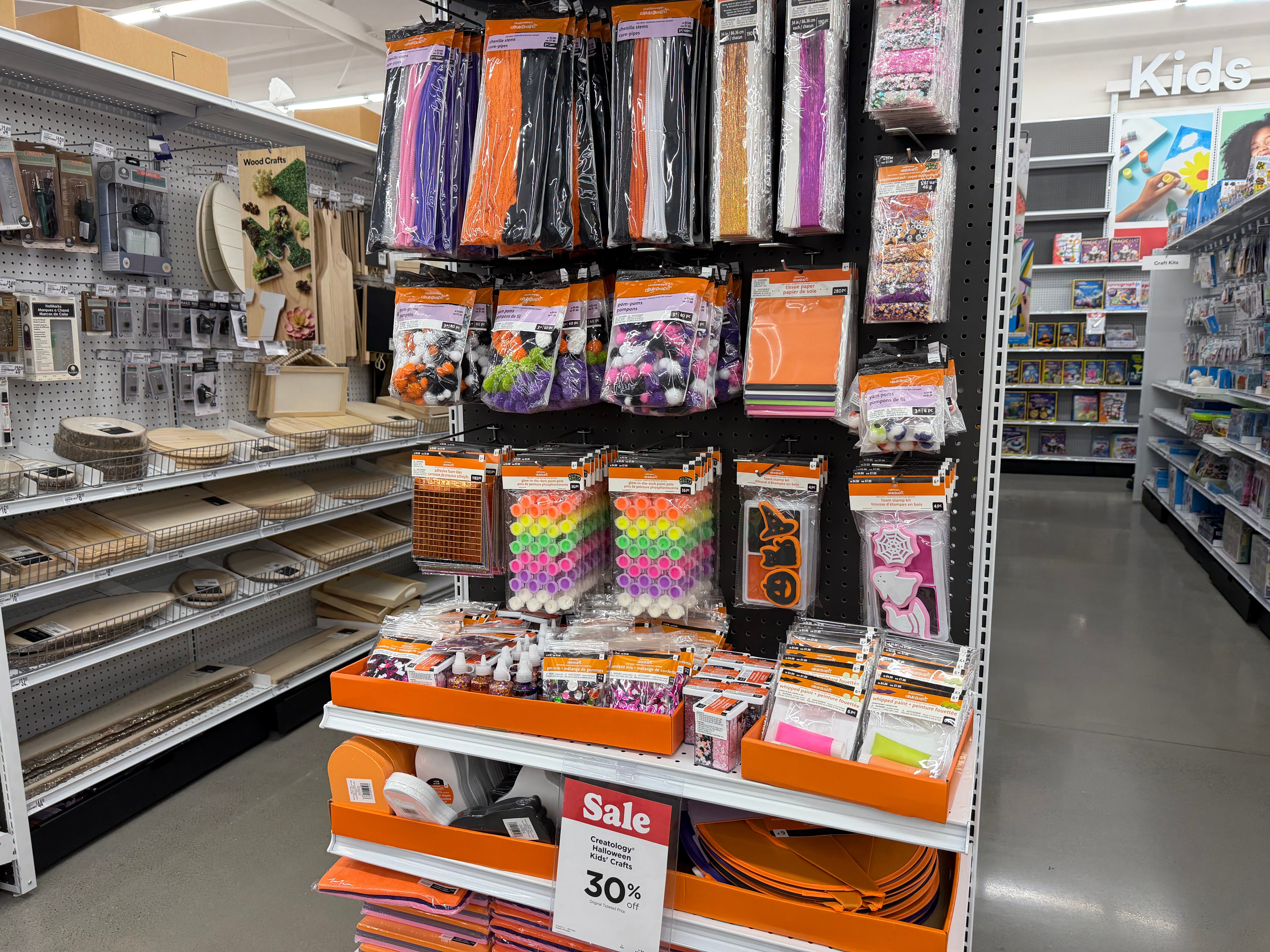 Halloween-themed craft kids on end cap in Michael's