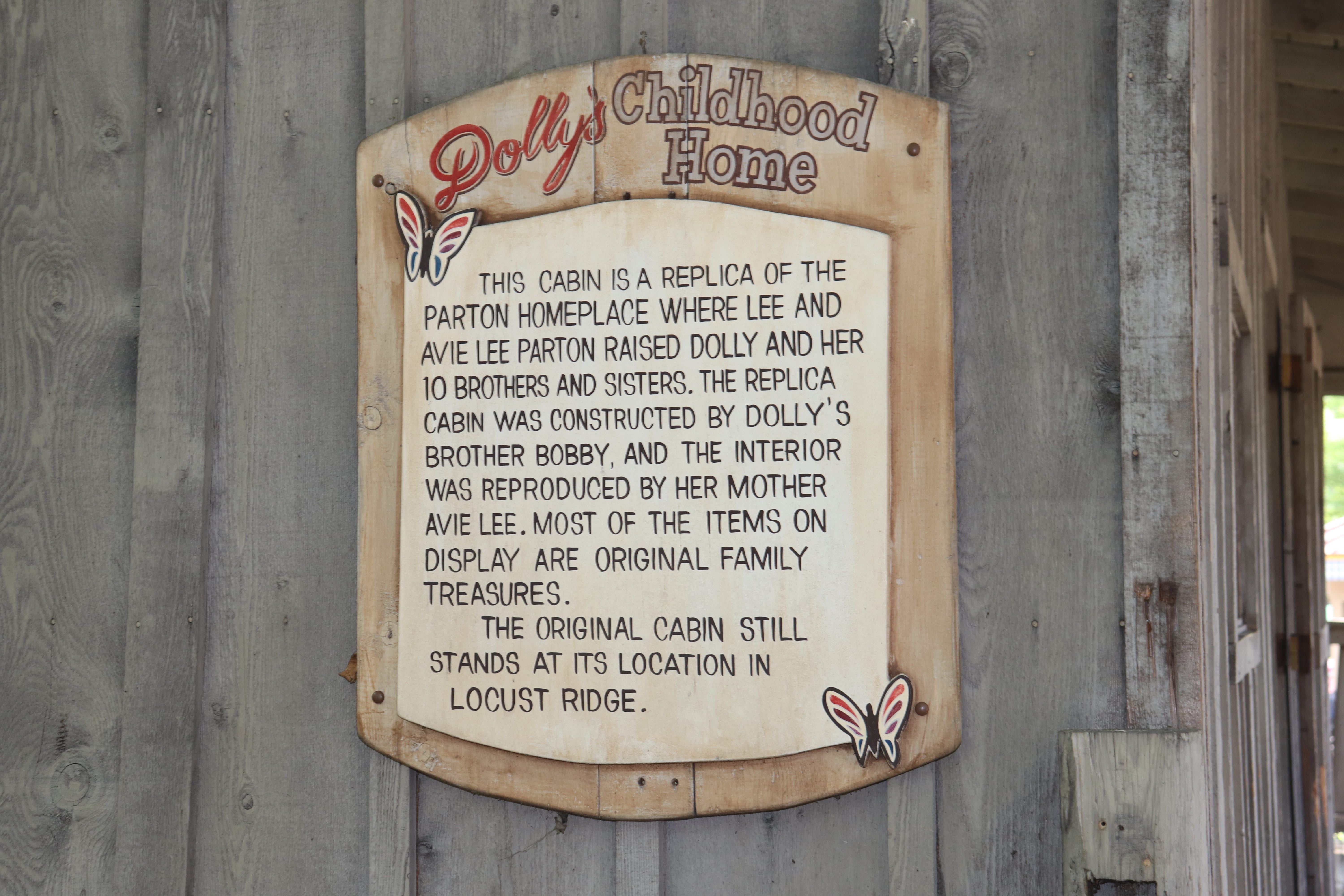 A sign outside Dolly Parton's childhood home at Dollywood.