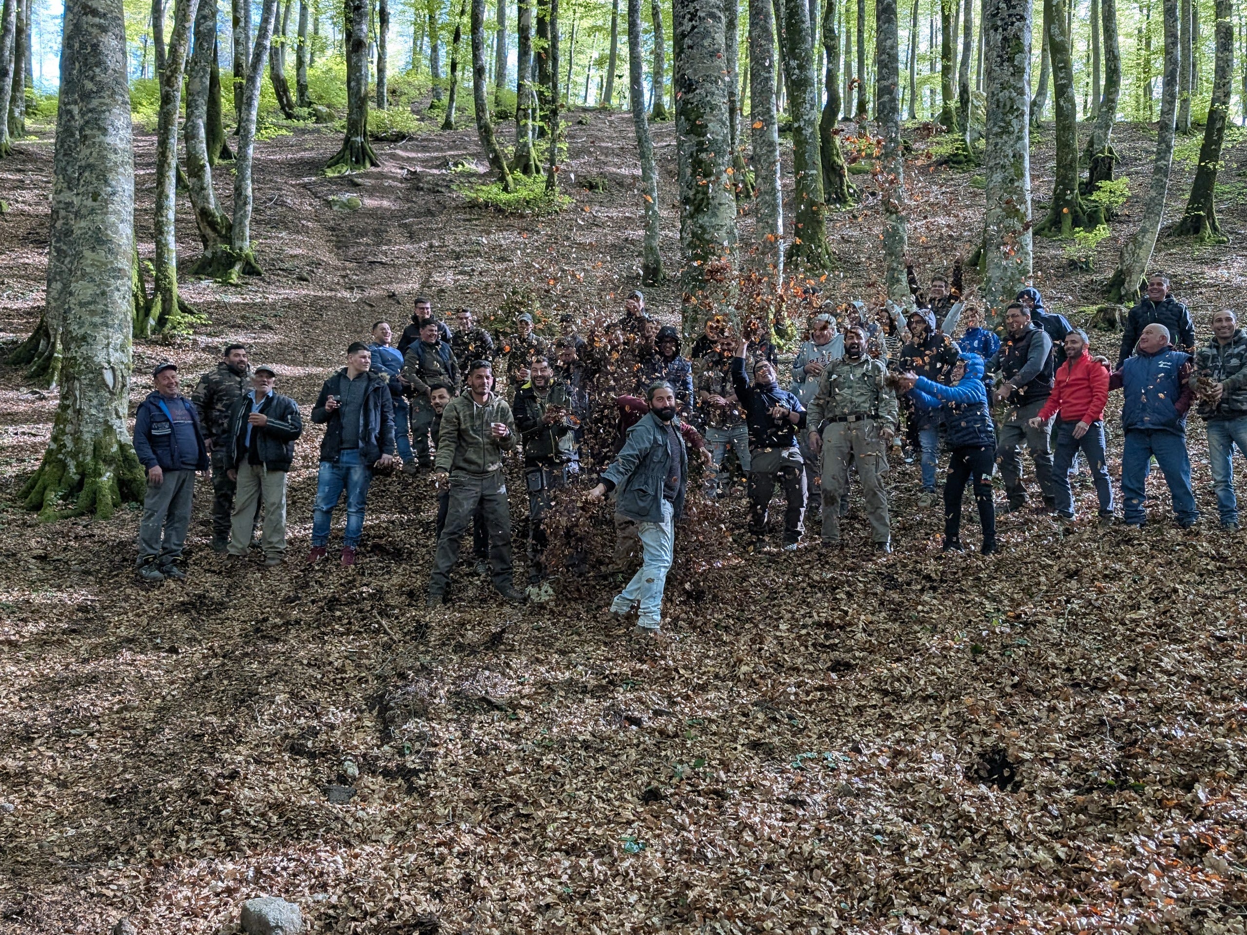 Group of people surrounded by trees