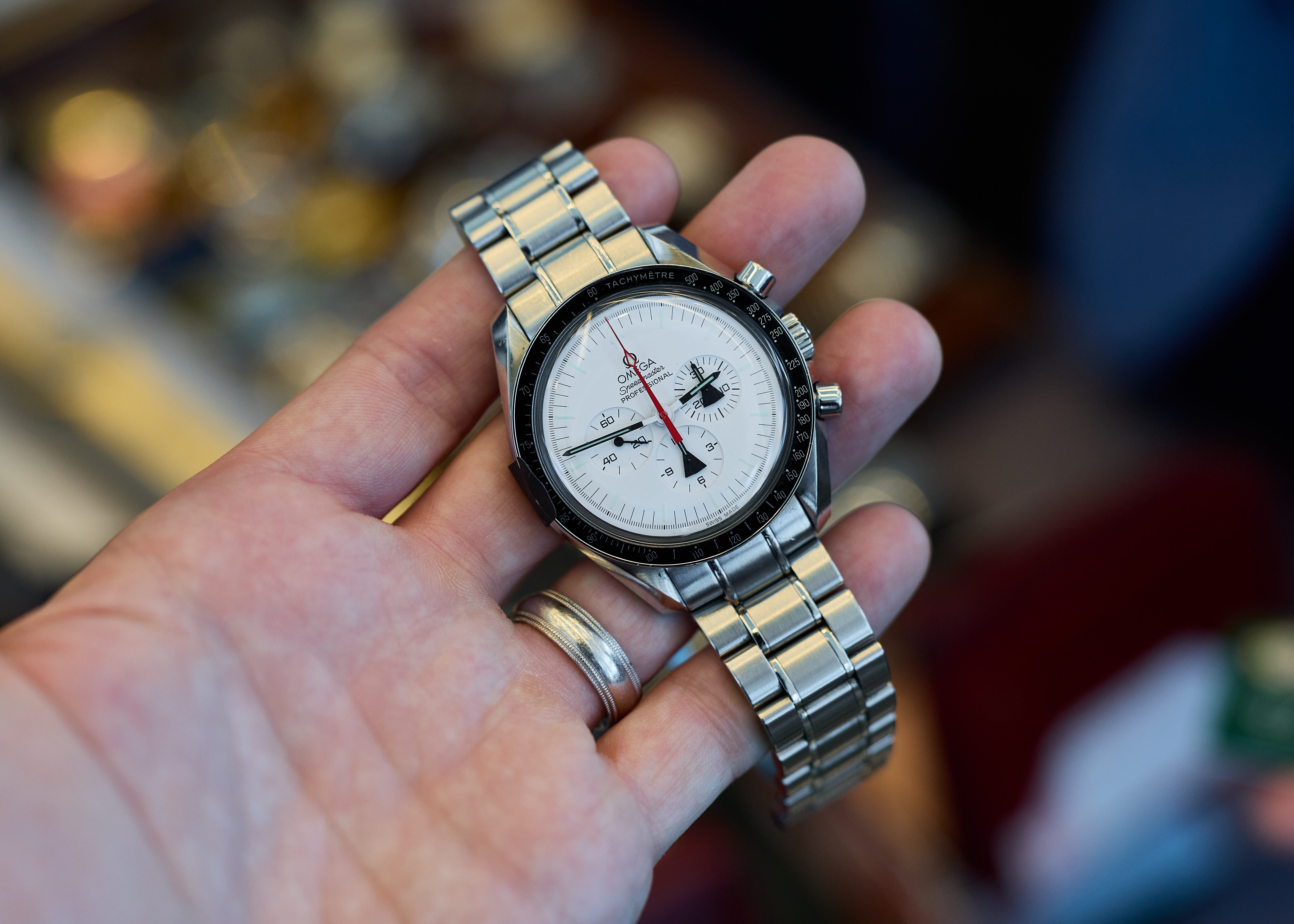 Hand holding Omega watch