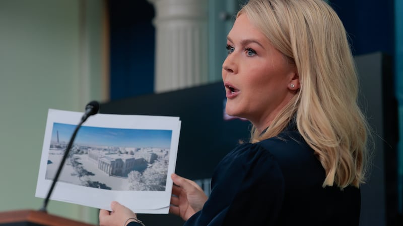 White House Press Secretary Karoline Leavitt holds up a picture during her briefing on July 31, 2025 as she announced President Donald Trump wants to build a new ballroom on White House grounds.