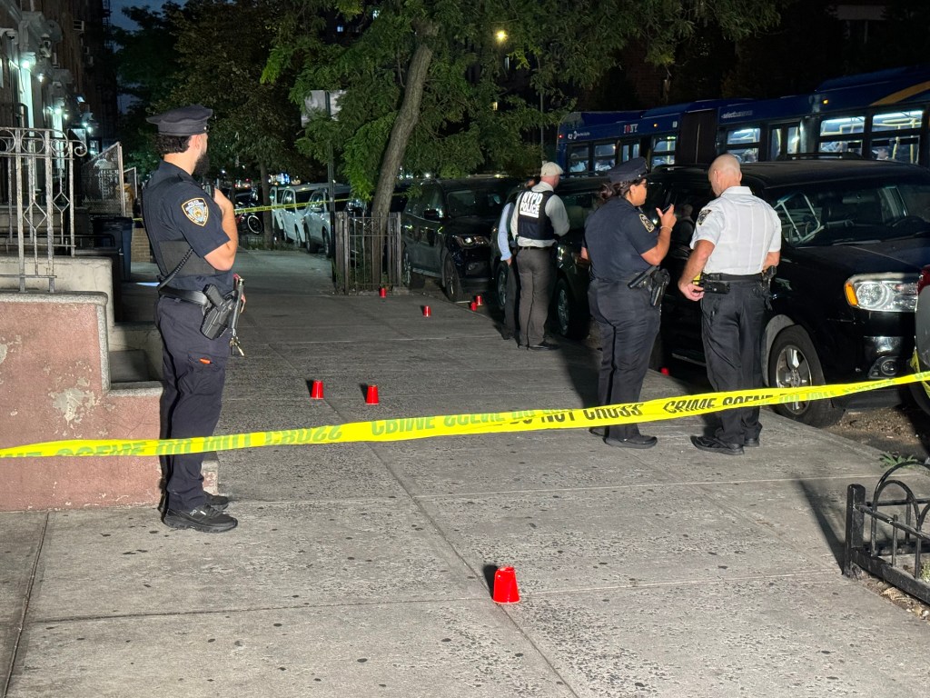 Police officers investigating a double shooting on Webster Avenue and East 187th Street in the Bronx.