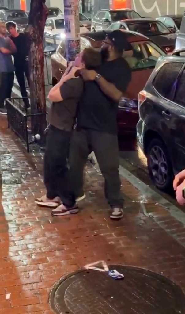 A bouncer puts a man in a chokehold outside a restaurant.