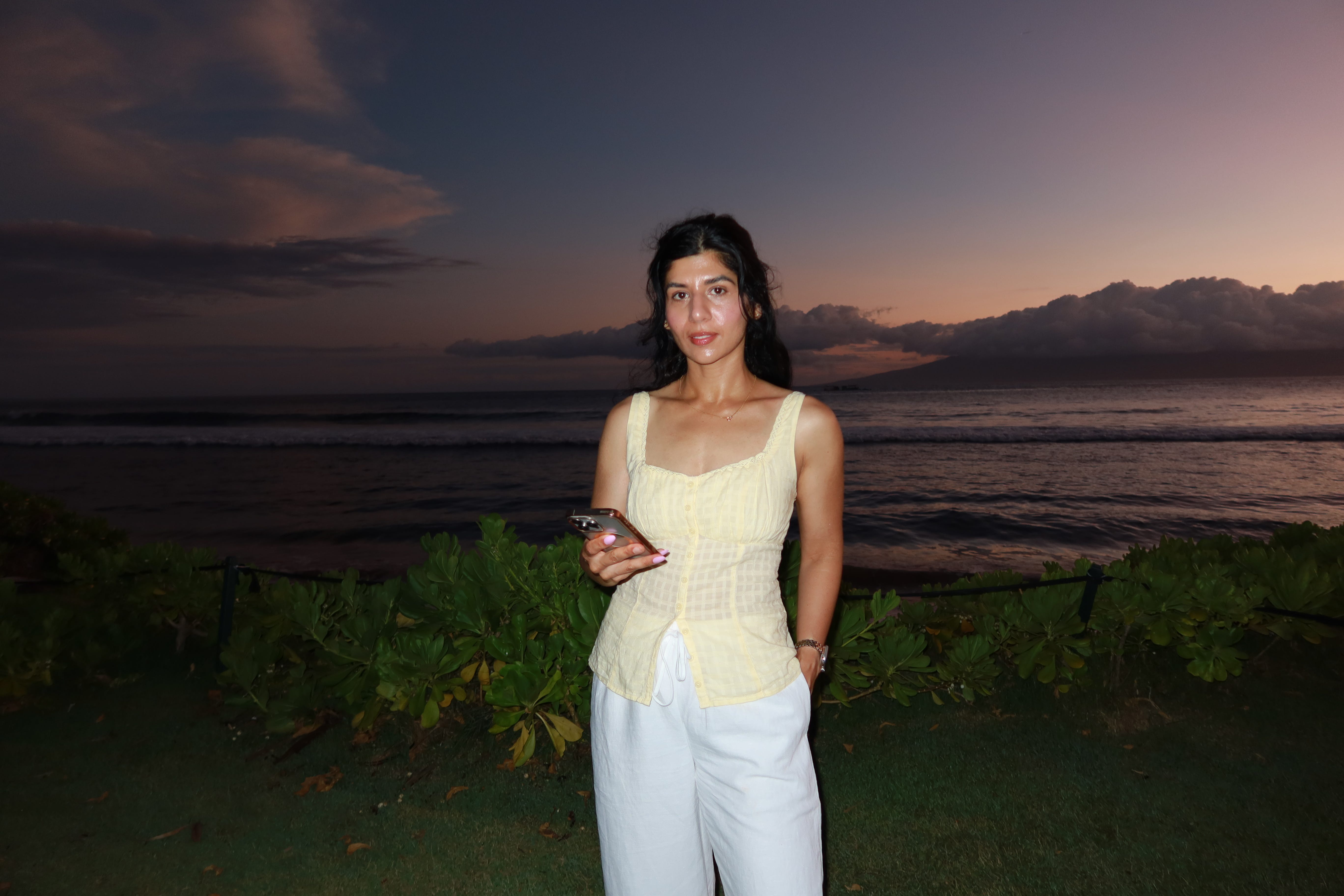 Sundas Khalid standing in front of the ocean.