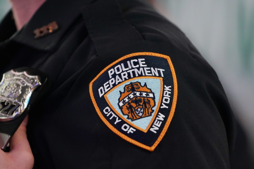 A general view of an NYPD arm patch in the Times Square section of New York, NY on August 7, 2021. 
