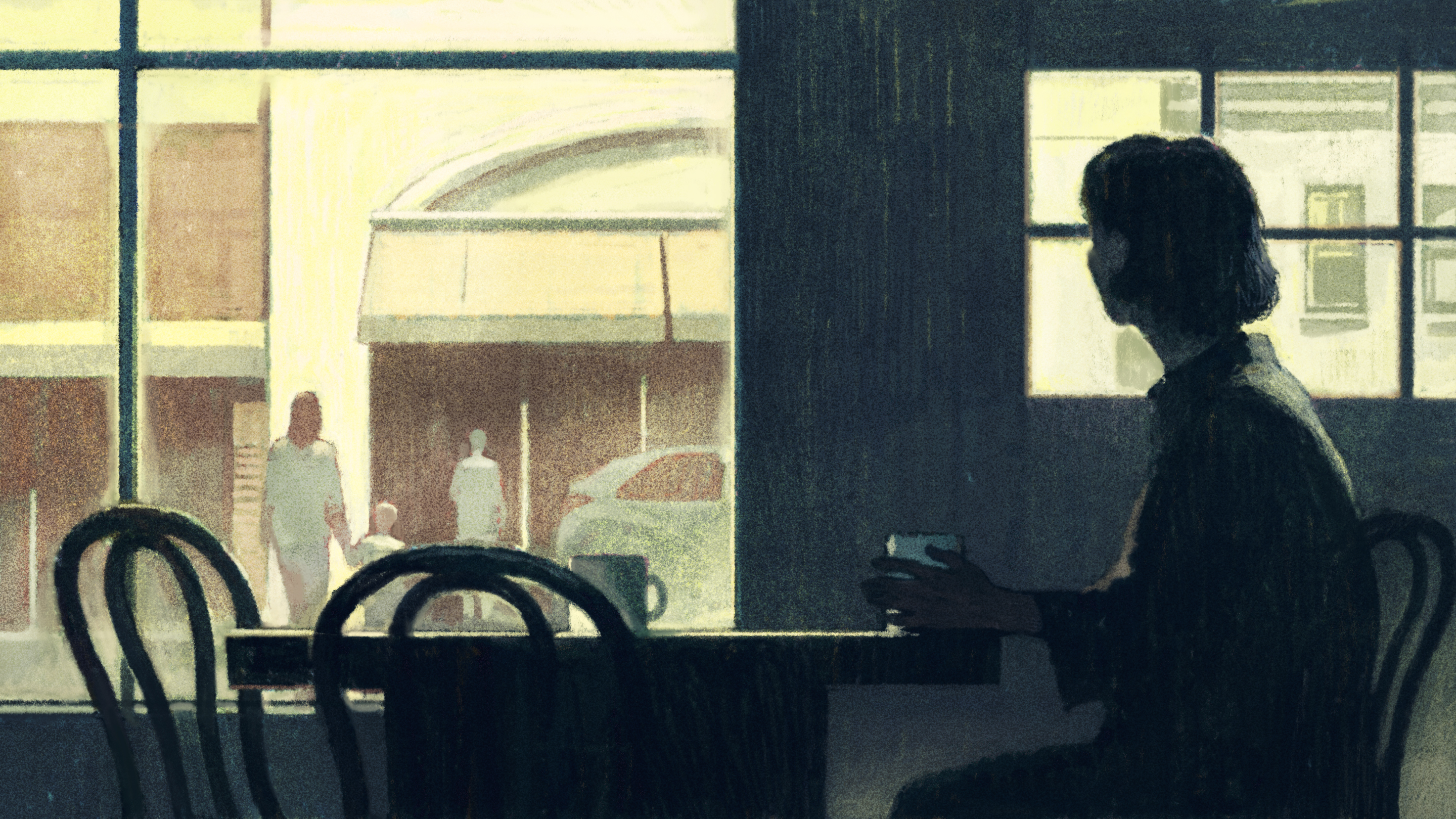 A woman sitting at a table inside a cafe, looking out the window at two adults and a child walking to car