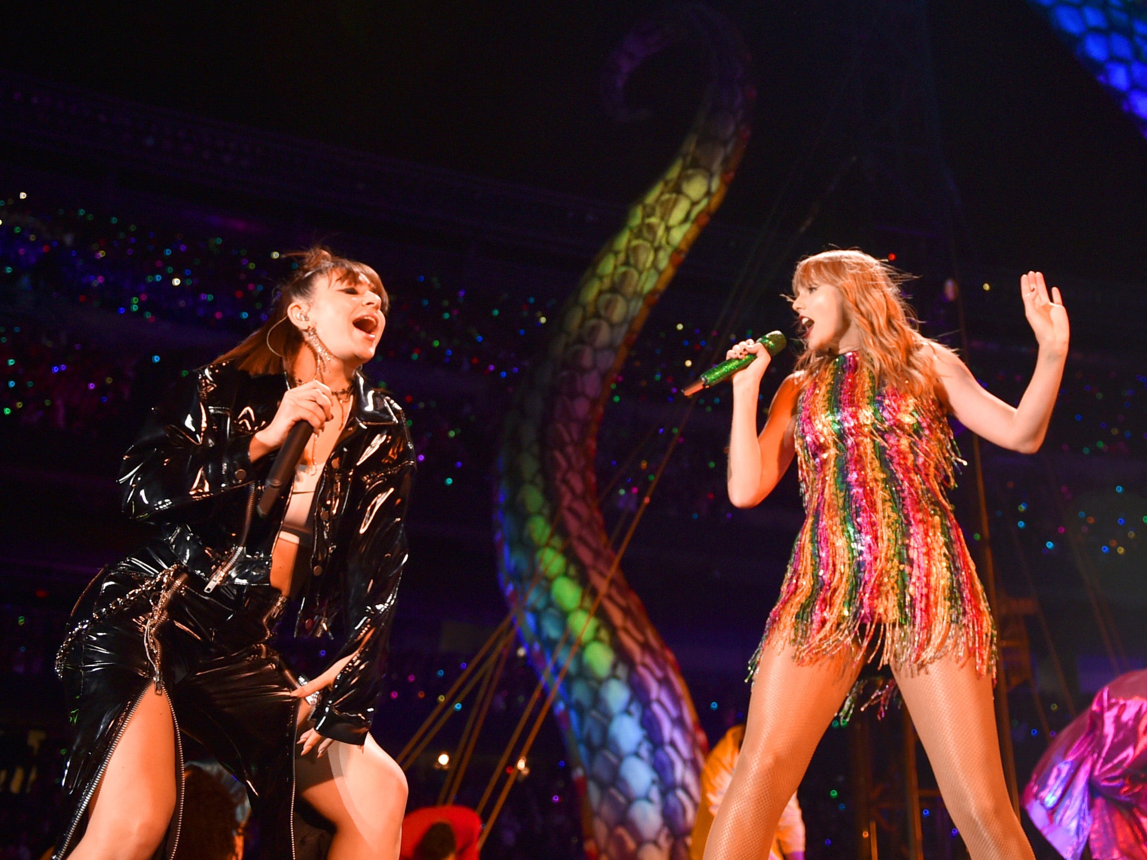 Charli XCX, Taylor Swift, and Camila Cabello perform onstage during the Reputation Stadium Tour in 2018.