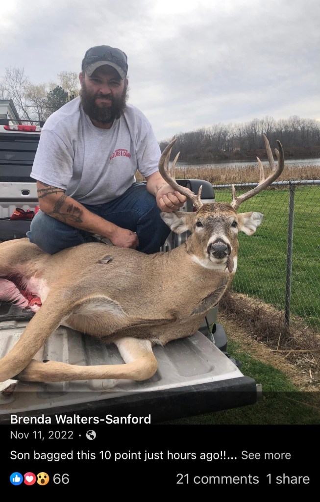 Thomas Michael Sanford with a deer.
