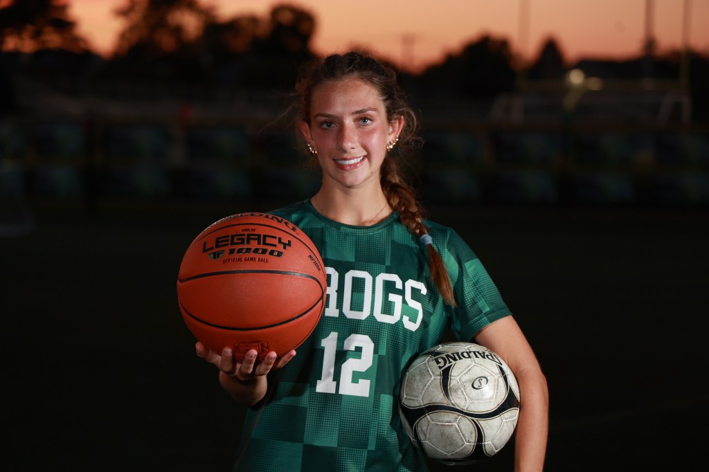 Carle Place H.S. Junior Madison Reedy, a three-sport star, holding a basketball and a soccer ball.