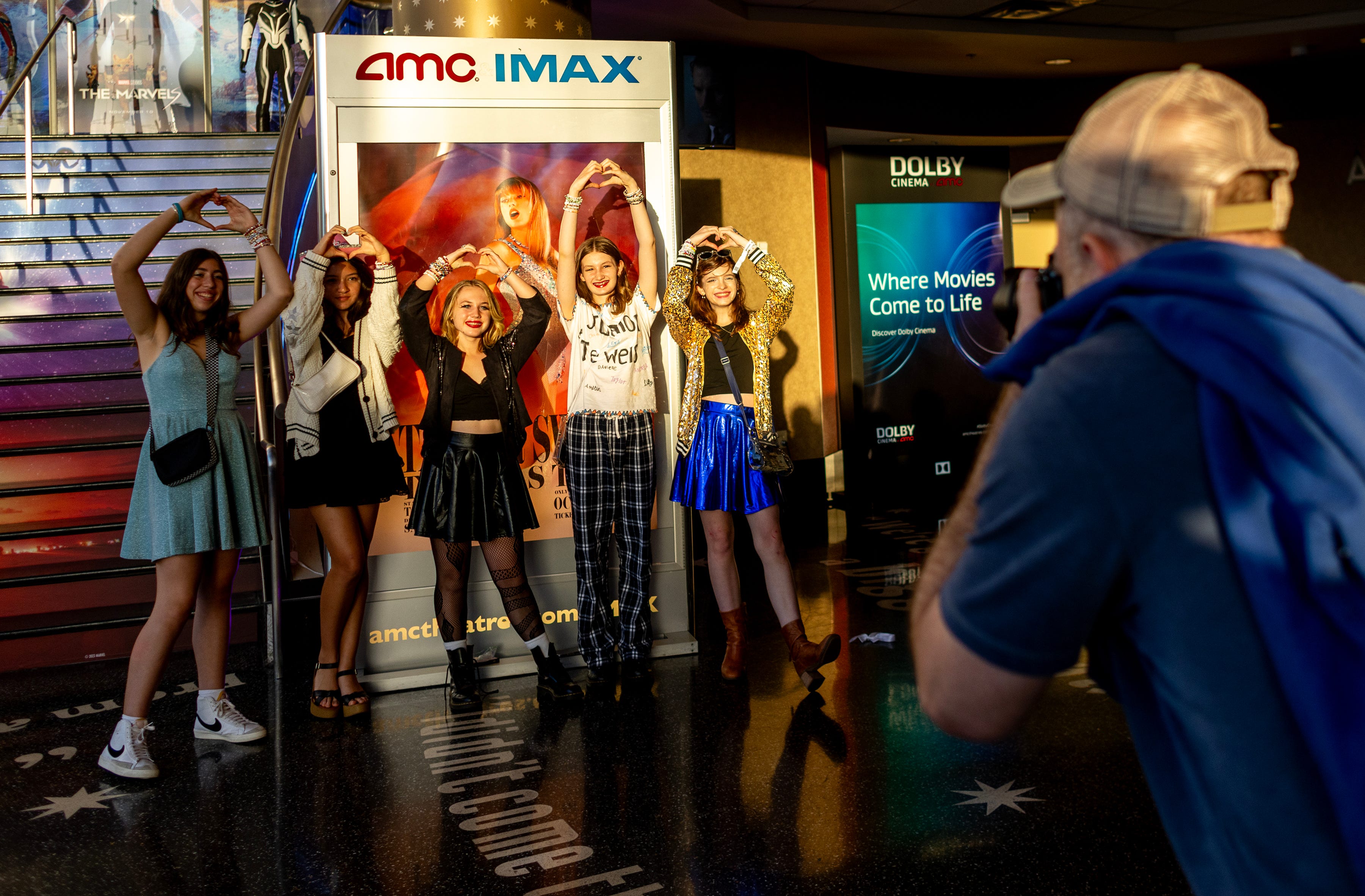 Taylor Swift fans attend Taylor Swift's Eras Tour concert movie in 2023.