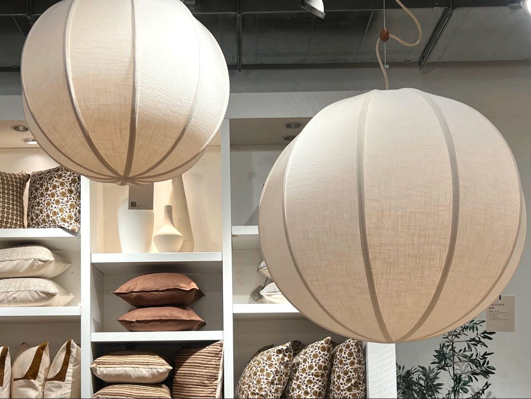 Two circular linen ceiling lamps.