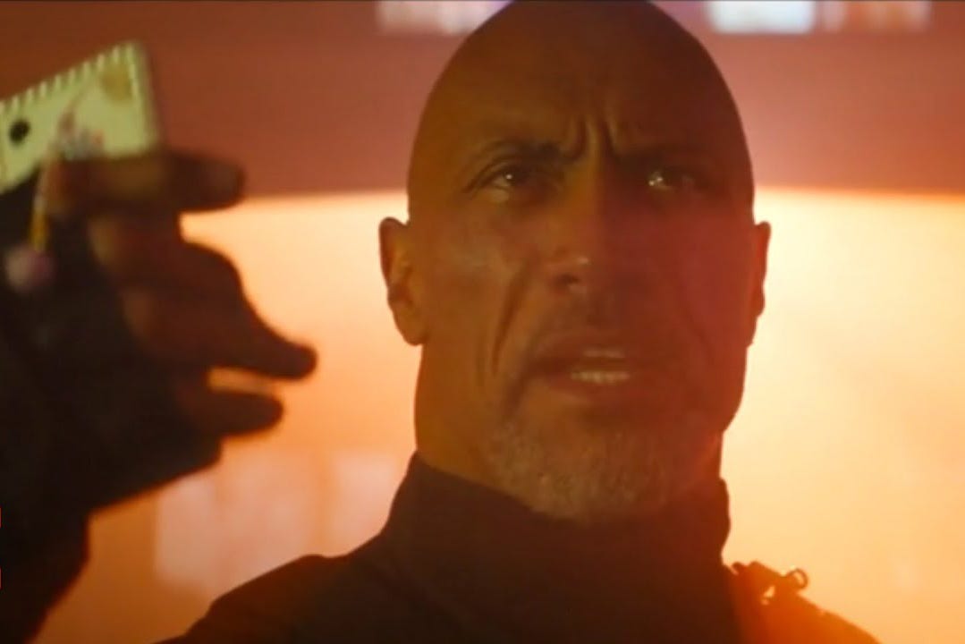 Dwayne Johnson holding a phone