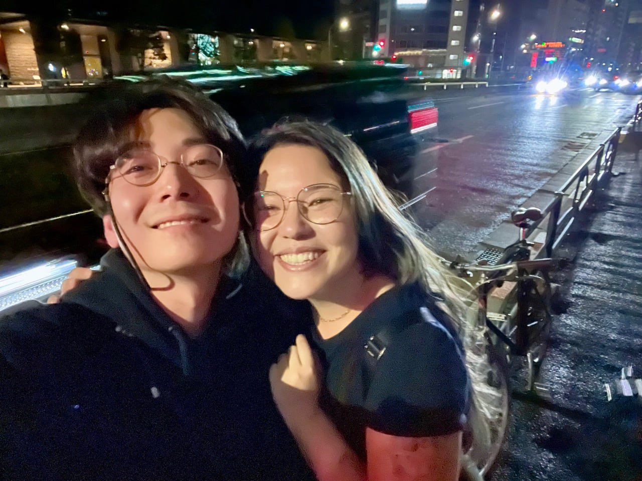 Author Ashley Probst smiling with man in Tokyo