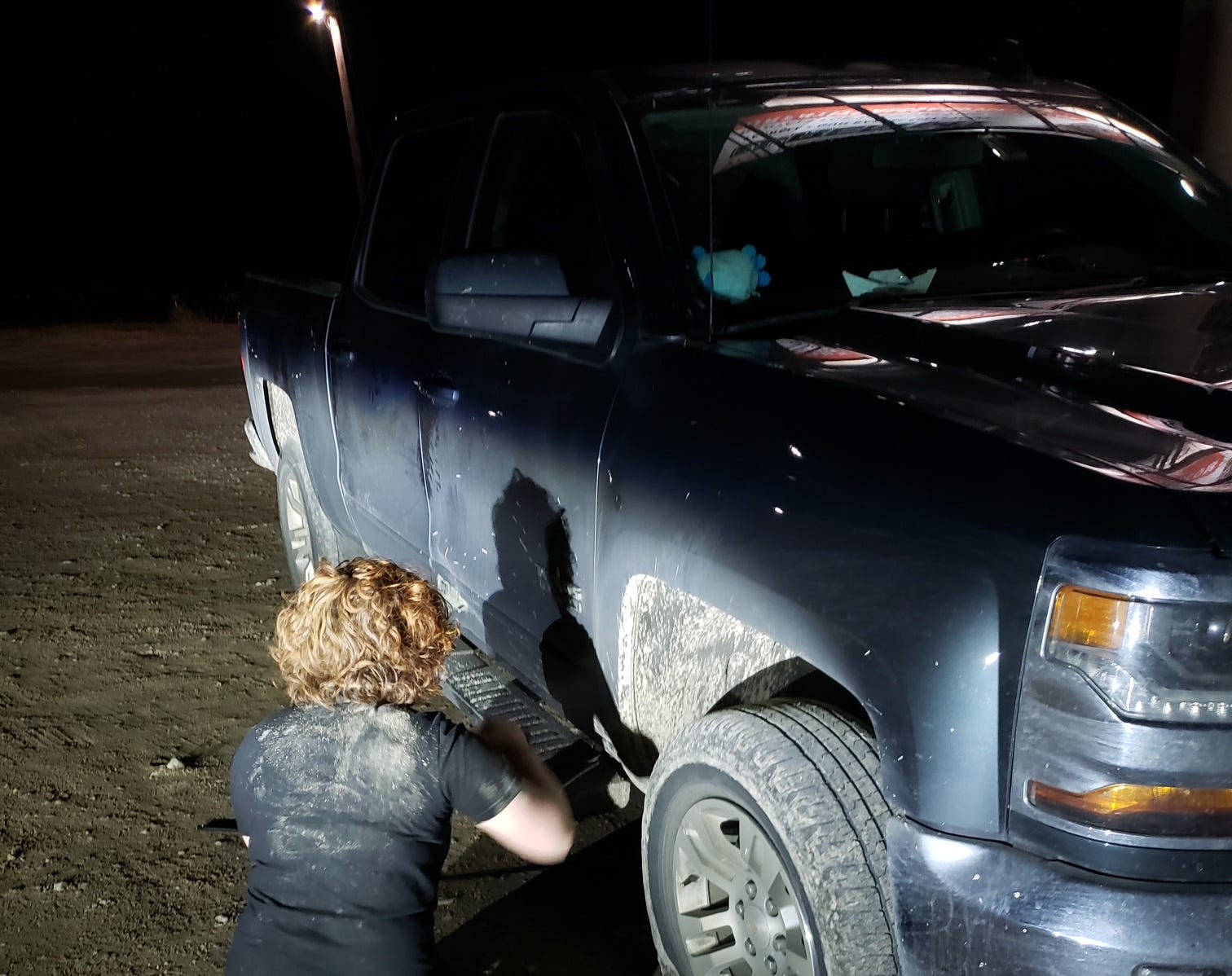 Young man chaging tire