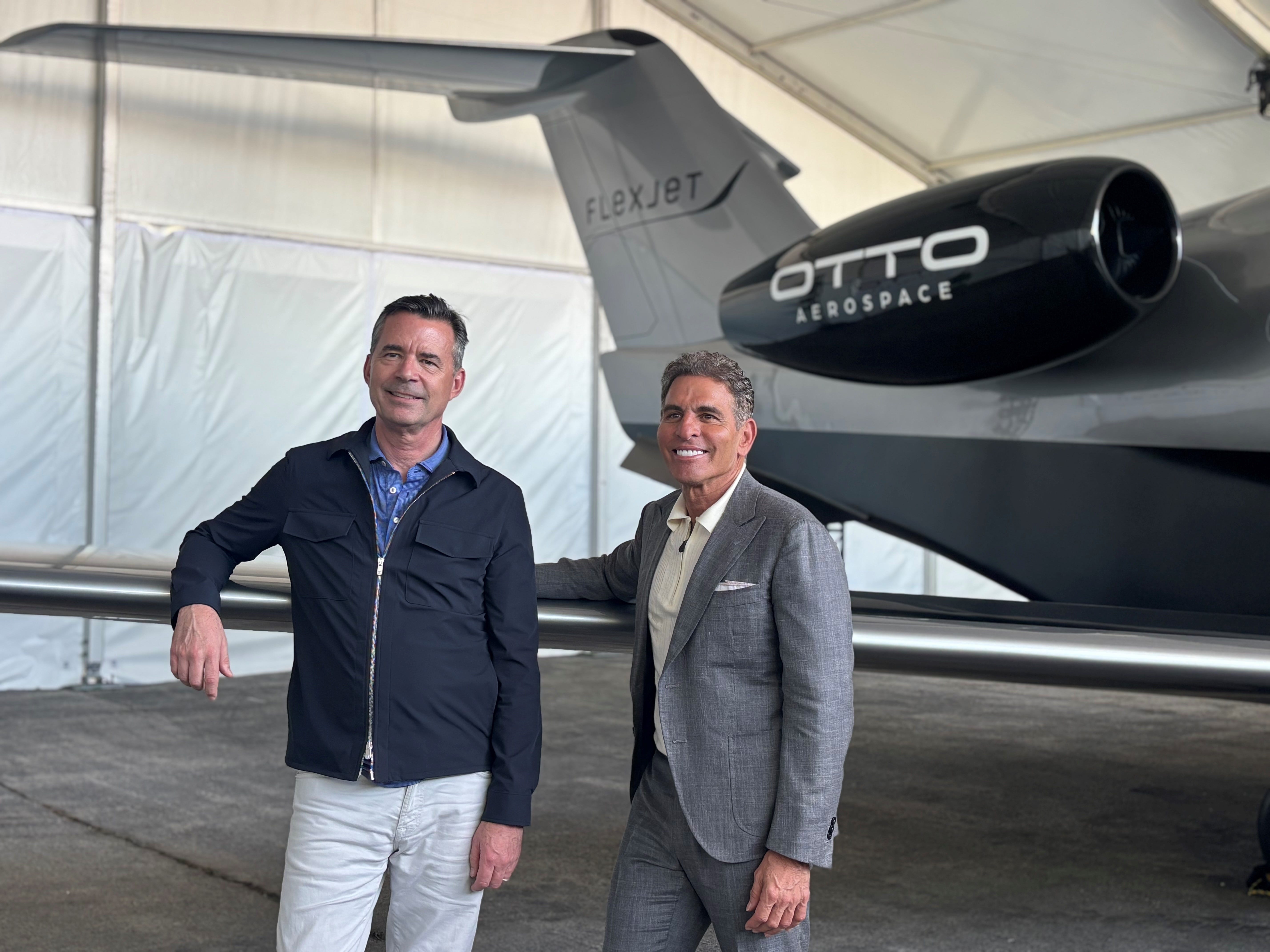 Paul Touw Otto CEO Left and Kenn Ricci Flexjet Chairman Right in front of Otto mockup.