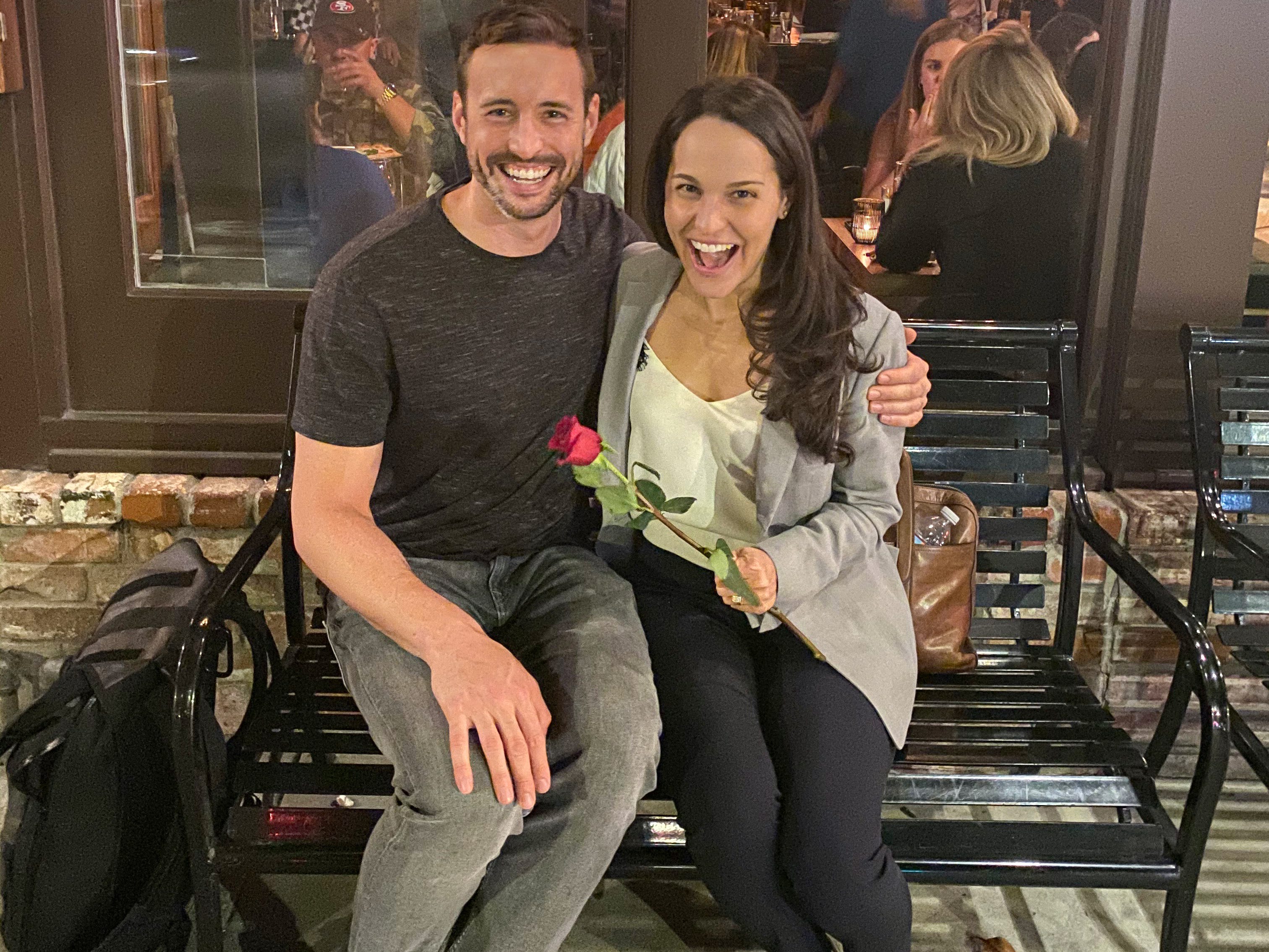 Rebecca Taber Staehelin holds a rose that Connor Diemand-Yauman gave her