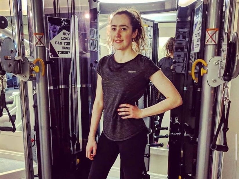 A woman posing at the gym