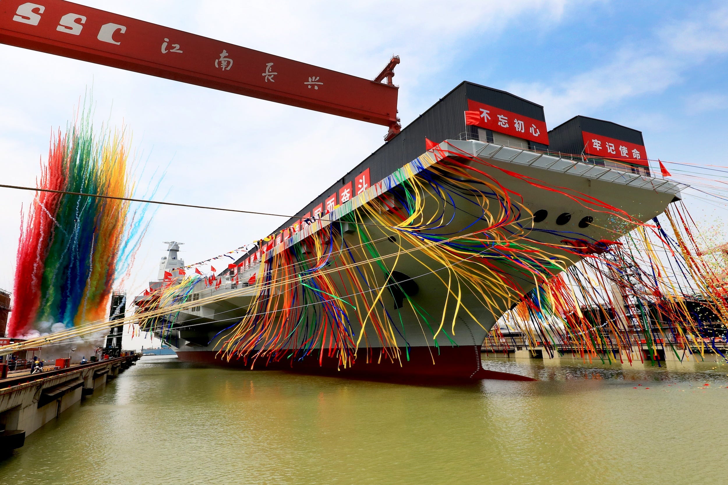 China's third aircraft carrier, the Fujian, adorns colorful decorations during a launching ceremony at Jiangnan Shipyard.