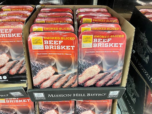 Smoked sliced beef brisket packs  on display at Costco