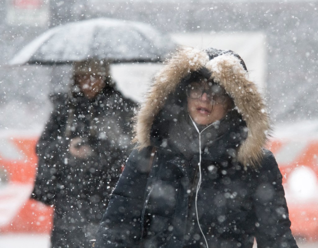 Manhattanites on the street enduring the Noreaster in NYC on March 21st, 2018