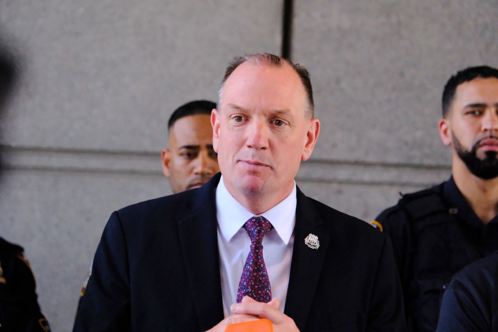 NYPD PBA President Patrick Henry speaks at a press conference.