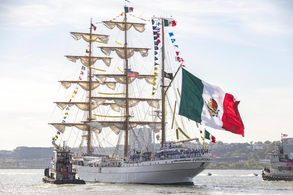 Officials and cadets aboard the Mexican Navy’s tall ship Cuauhtémoc prepare to depart Pier 86 after a farewell ceremony at the Intrepid Museum.