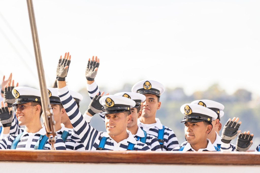 Sailors aboard the Cuauhtémoc handle lines during the vessel’s departure from New York Harbor.