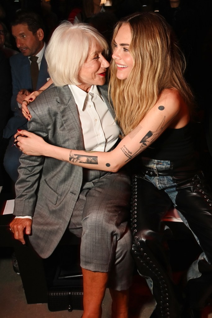 Helen Mirren (left) and Cara Delevingne get close in a cramped front row at Stella McCartney’s show at Paris fashion week.

