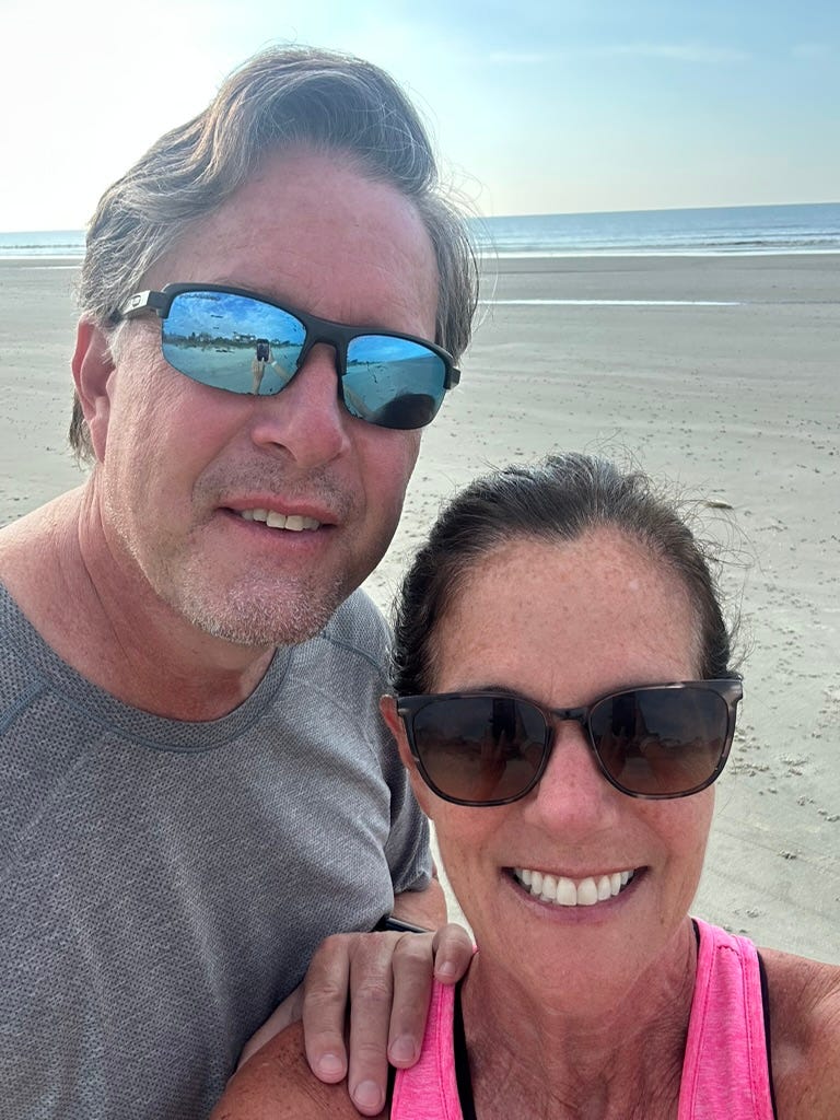 The author and her husband on a beach.
