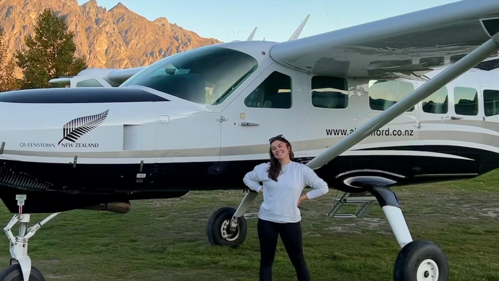The author in front of a small plane in New Zealand.
