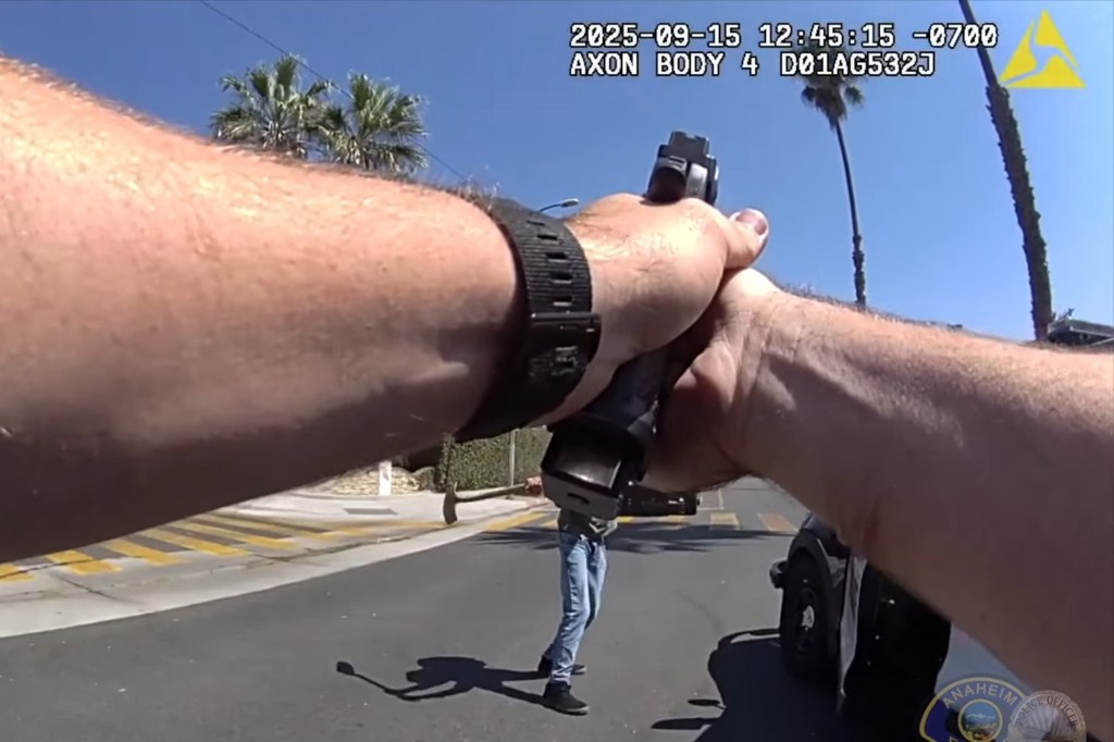 Bodycam footage of an Anaheim police officer aiming a gun at Rudy Anthony Martinez II, who is holding a shovel.