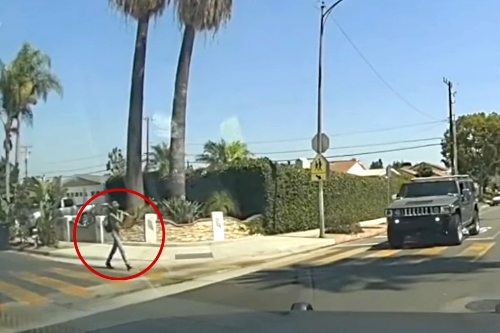 Rudy Martinez, carrying a shovel, seen near John Marshall Elementary School.