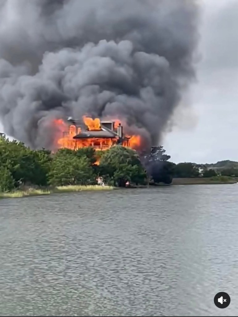 House belonging to South Carolina Judge and ex-senator Diane Goodstein ablaze with large flames and dark smoke billowing into the sky.