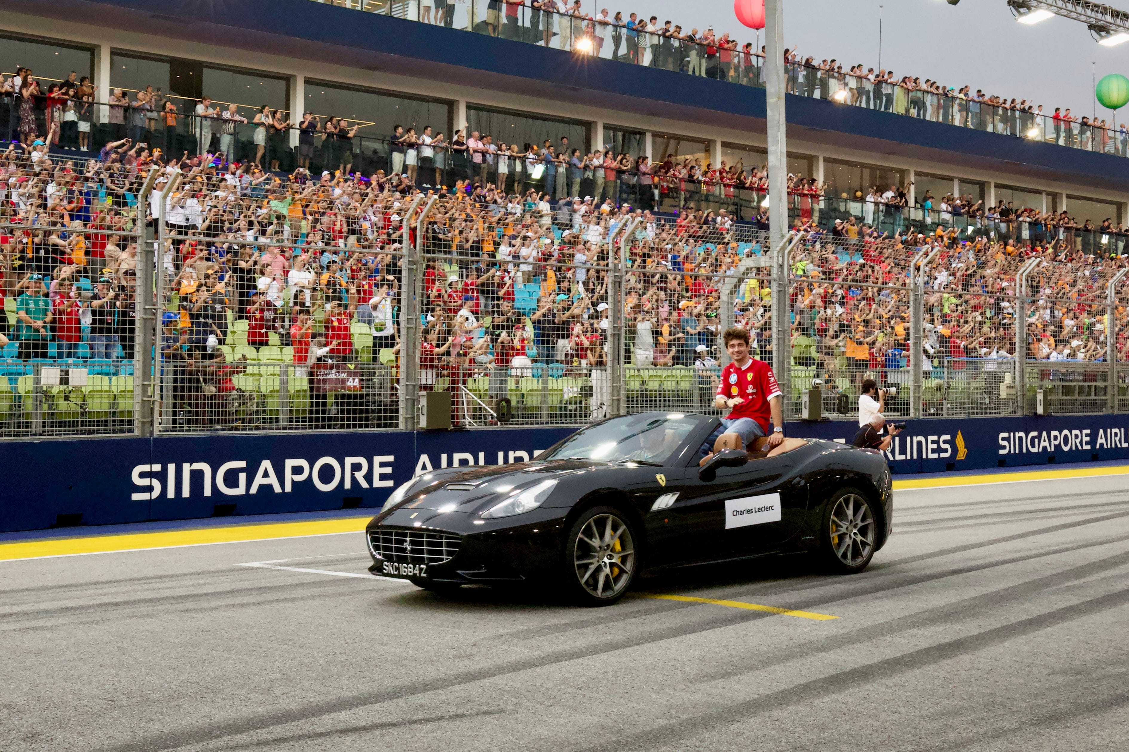 The drivers enjoyed a cooling breeze during the drivers' parade, their last chance to cool down before the two-hour race in the heat.