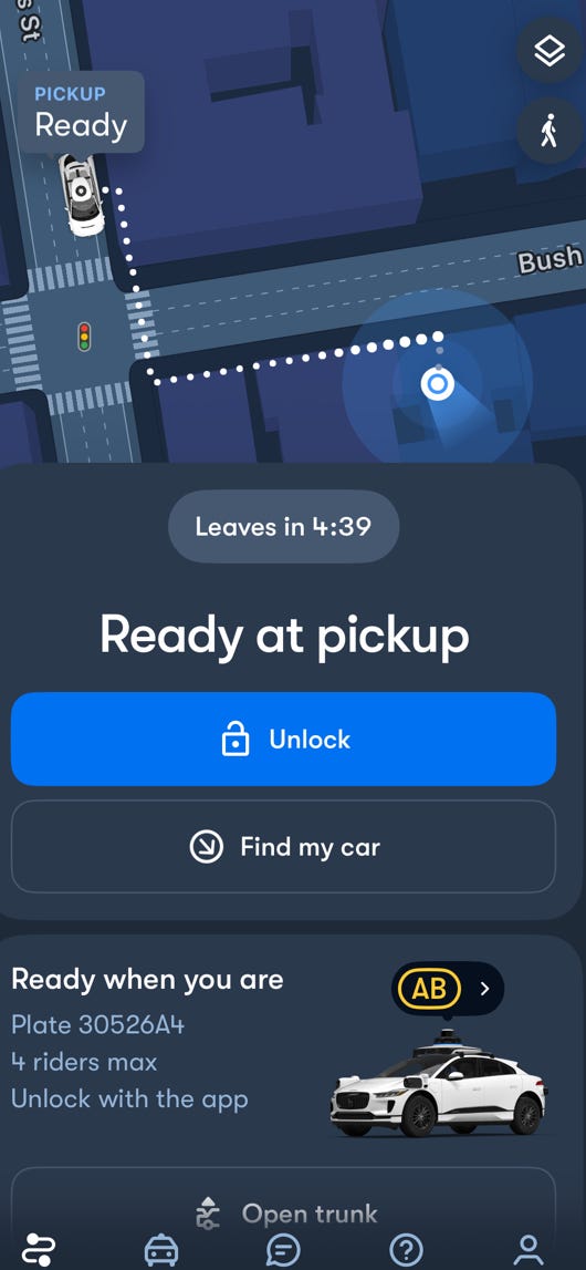A screenshot shows a map and the location of a car on the Waymo app.