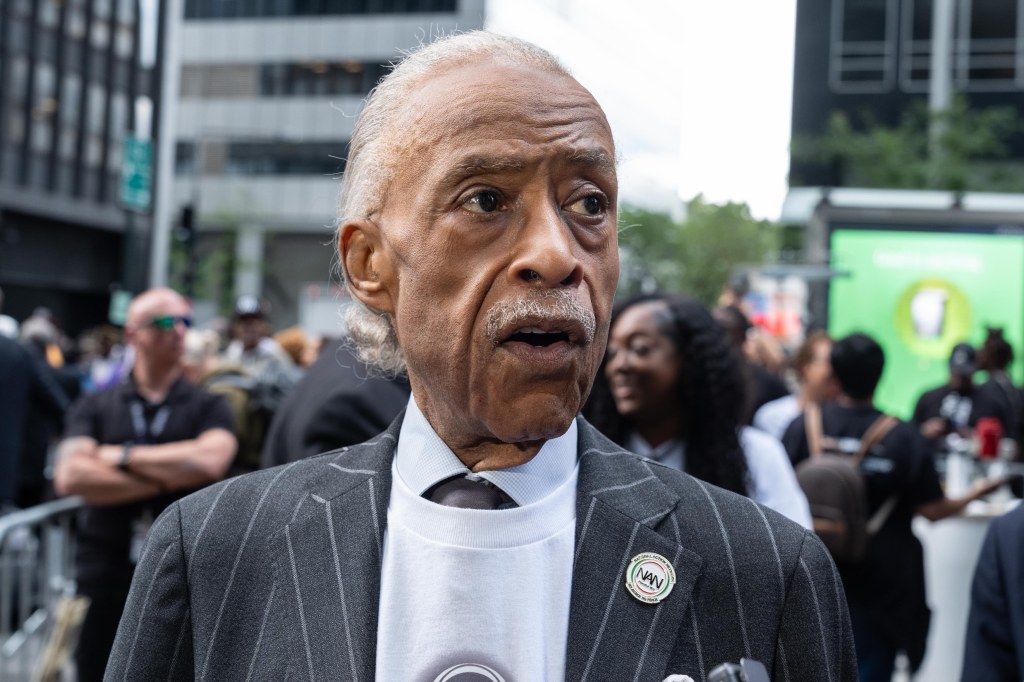 Reverend Al Sharpton speaks to the press after the rally at the end of 'March on Wall Street' organized by NAN on Aug. 28, 2025.