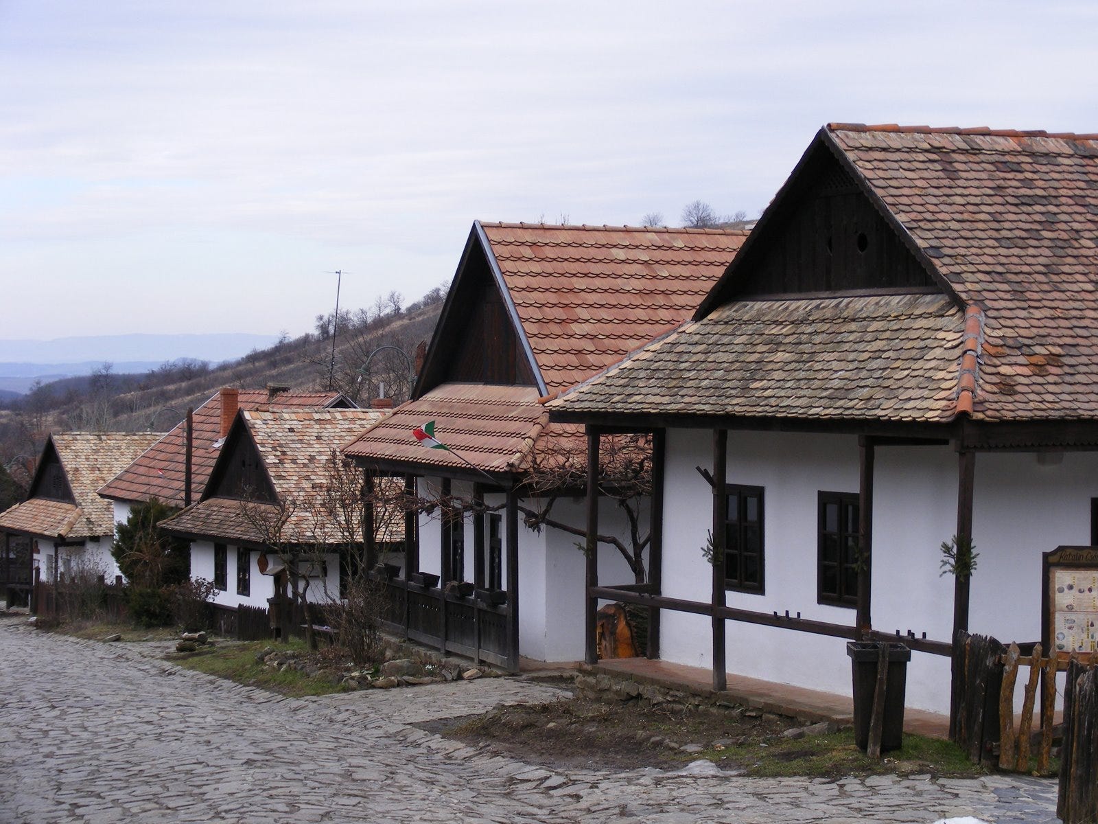 Traditional white houses with dark brown beams in Hollókő, Hungary.