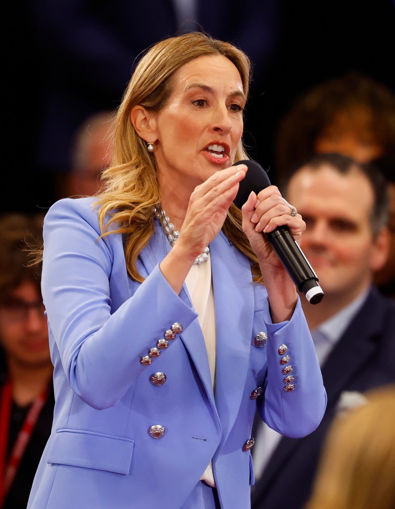 Democrat Mikie Sherrill speaks into a microphone.