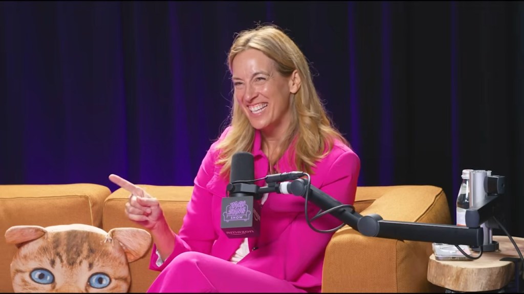 Mikie Sherrill smiling and pointing during an interview on the Zach Sang Show.
