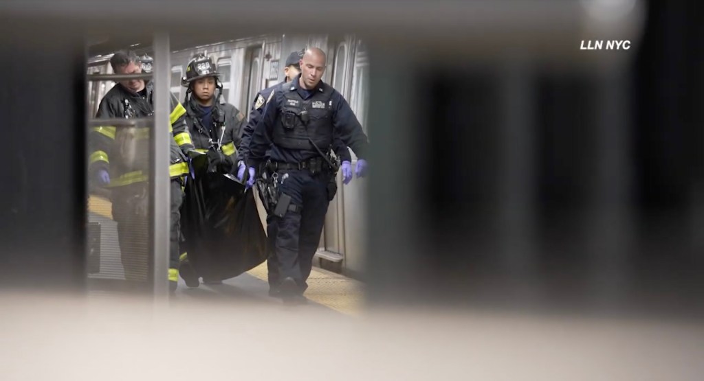 First responders removing remains from a subway station.
