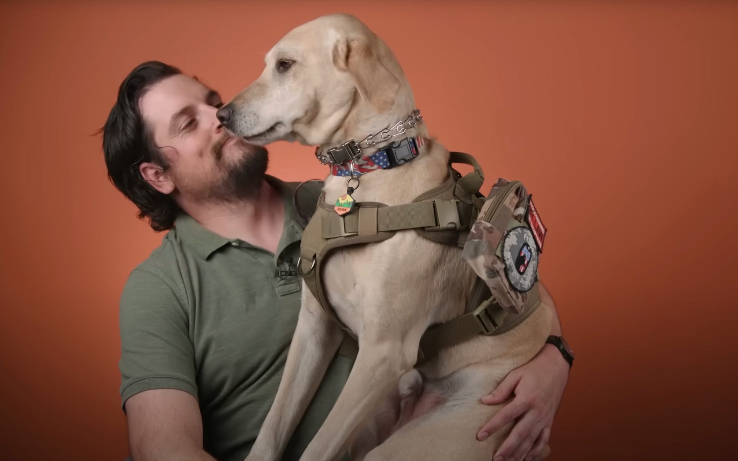 Man with large yellow dog sitting on his lap.