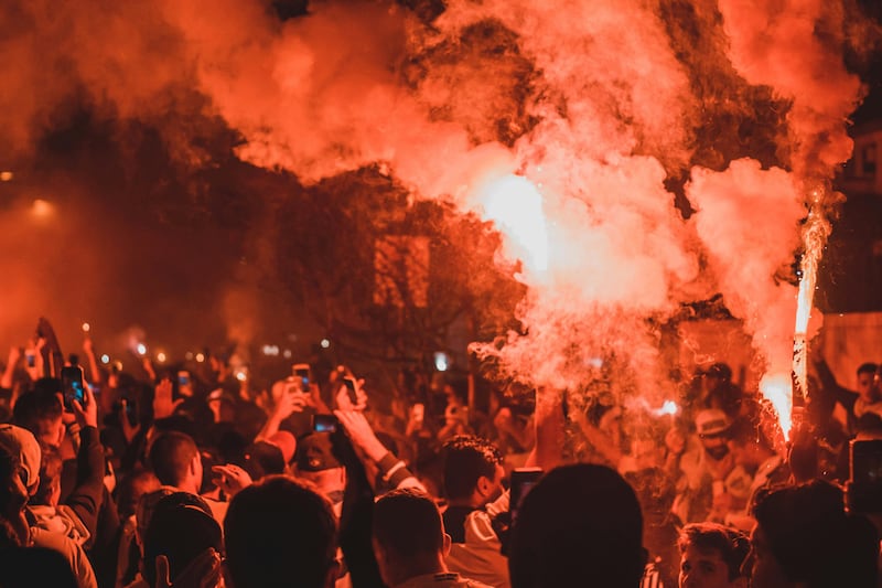 A protest with flares held aloft