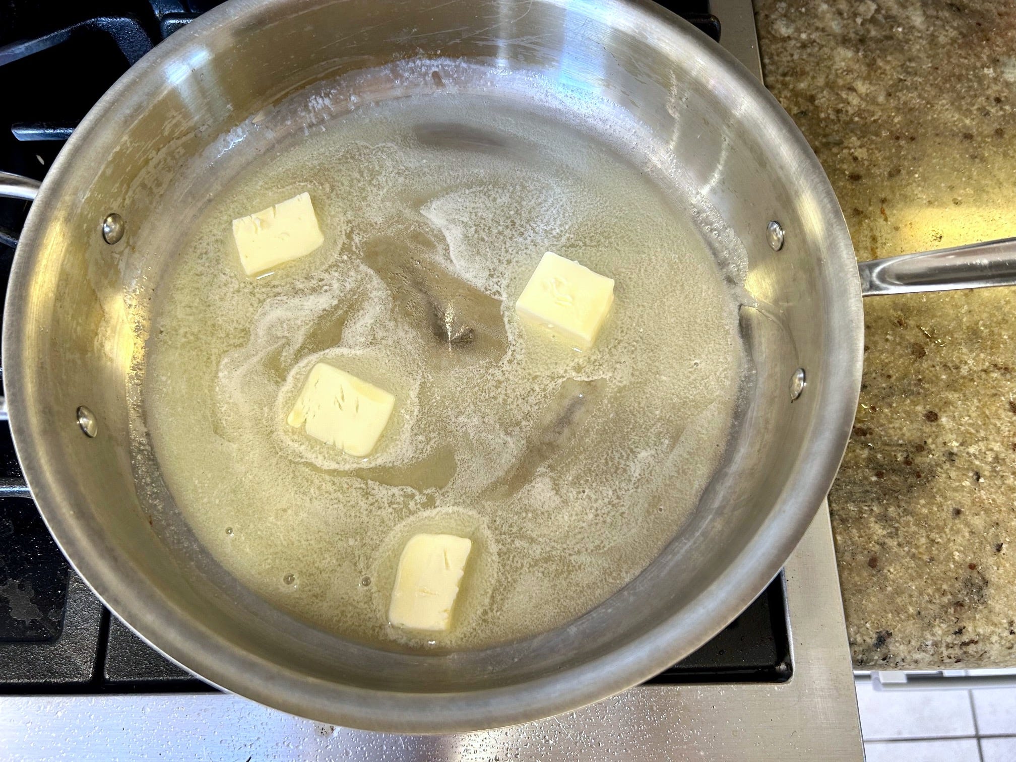 Melting butter for Ina Garten's Hashed Brown Potatoes