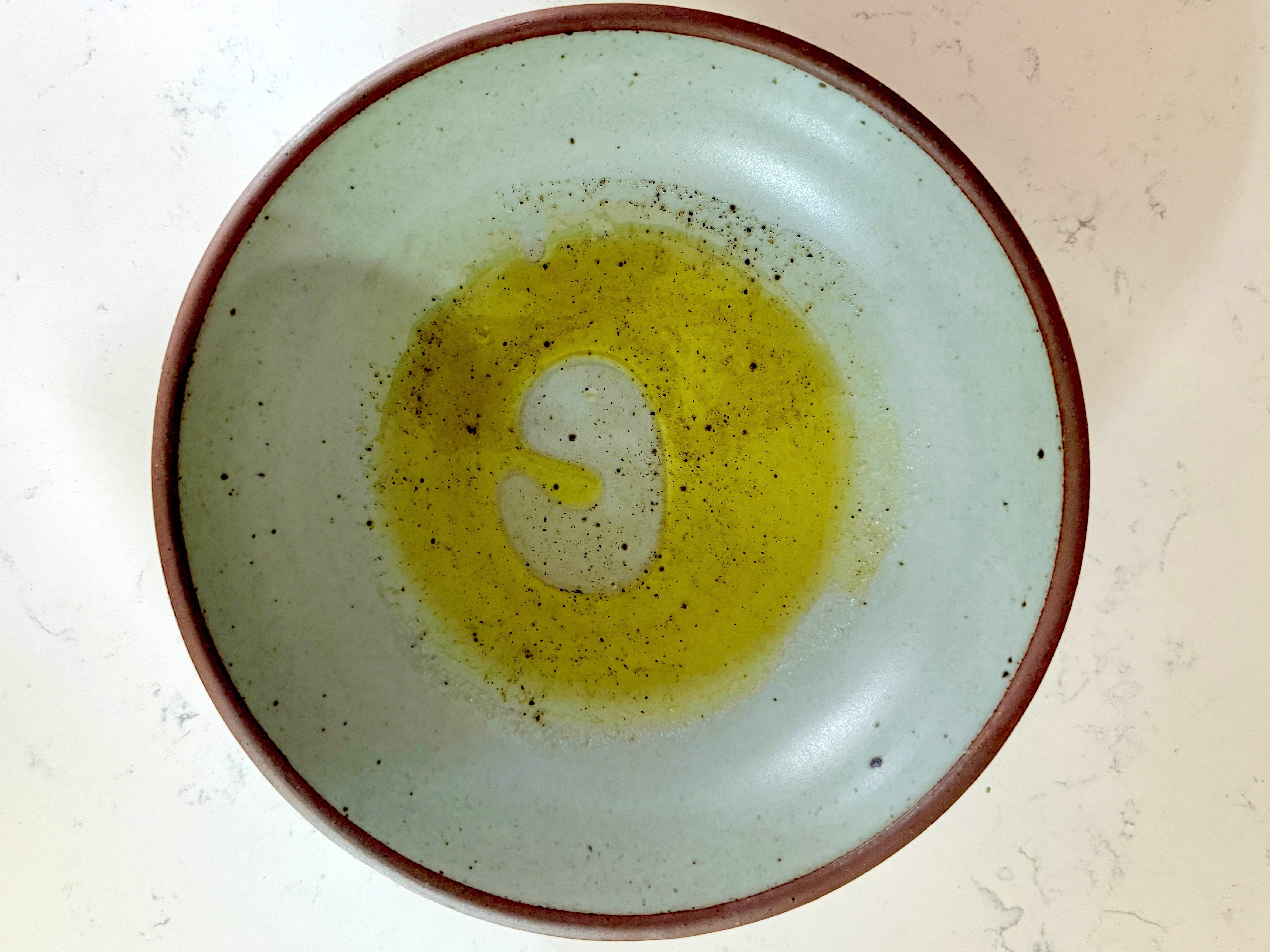 A bowl of dressing.
