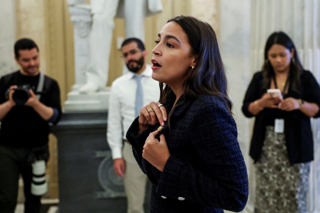 U.S. Rep. Ocasio-Cortez speaks to a group of middle school students while giving a tour of the U.S. Capitol.